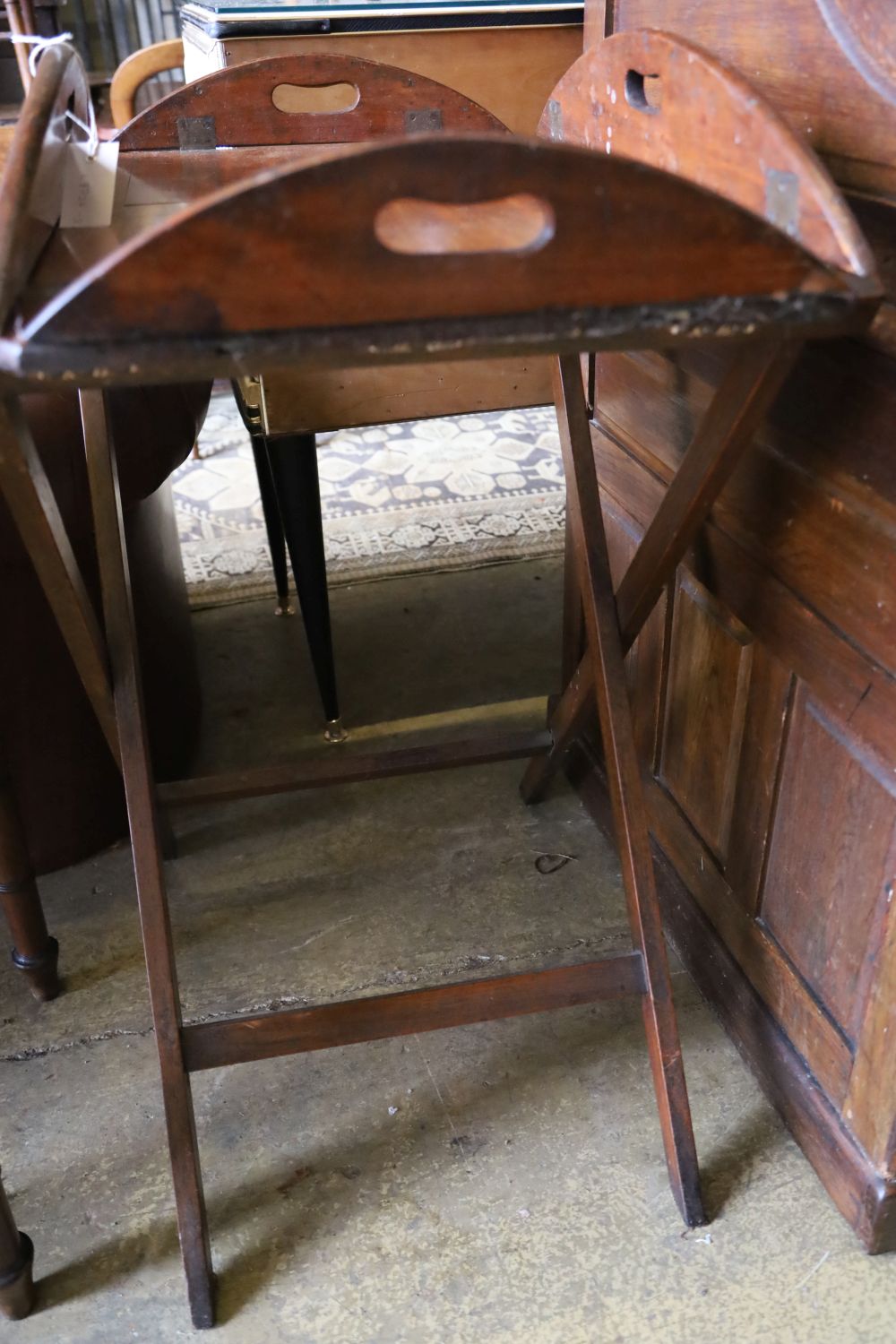 A George III mahogany folding butlers tray, with folding stand, width 86cm, depth 65cm, height 84cm